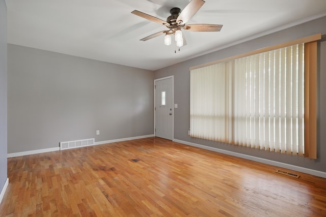 1451 Peachwood Dr, Flint, MI 48507 - spare room with ceiling fan, wood finished floors, and baseboards