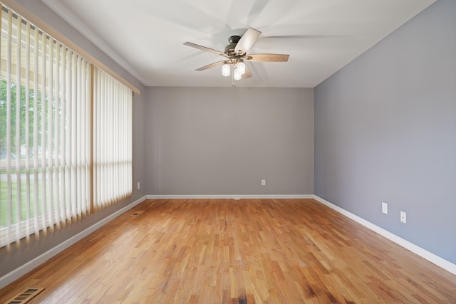 1451 Peachwood Dr, Flint, MI 48507 - spare room with light wood finished floors, baseboards, and ceiling fan