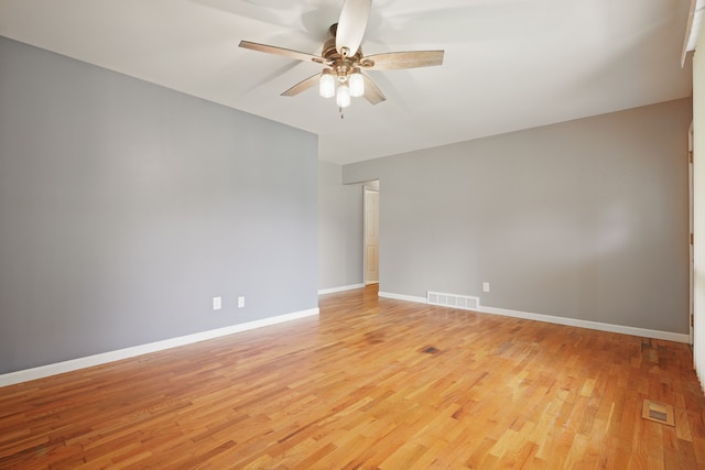 1451 Peachwood Dr, Flint, MI 48507 - empty room with ceiling fan, light wood-style floors, and baseboards