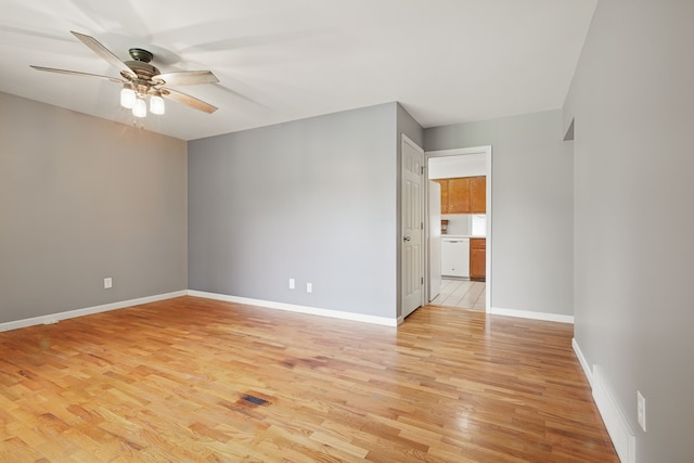 1451 Peachwood Dr, Flint, MI 48507 - spare room with ceiling fan, light wood-style flooring, and baseboards