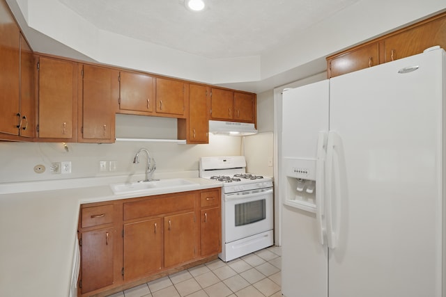 1451 Peachwood Dr, Flint, MI 48507 - kitchen featuring white appliances, under cabinet range hood, a sink, light tile patterned floors, and light countertops