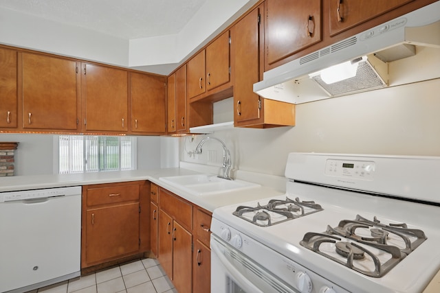 1451 Peachwood Dr, Flint, MI 48507 - kitchen featuring white appliances, under cabinet range hood, light countertops, a sink, and brown cabinetry