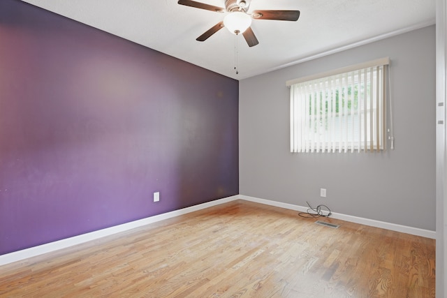 1451 Peachwood Dr, Flint, MI 48507 - spare room with ceiling fan, baseboards, and wood finished floors