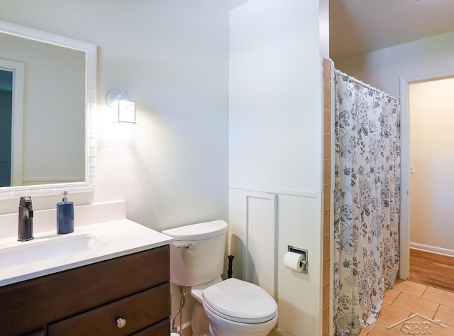 1466 Wilson Ave, Saginaw, MI 48638 - bathroom featuring toilet, vanity, tile patterned floors, and curtained shower