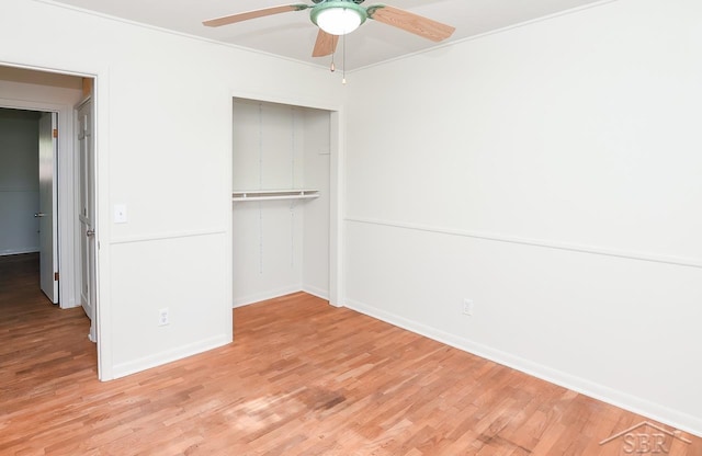 1466 Wilson Ave, Saginaw, MI 48638 - unfurnished bedroom featuring a closet, wood finished floors, baseboards, ceiling fan, and ornamental molding