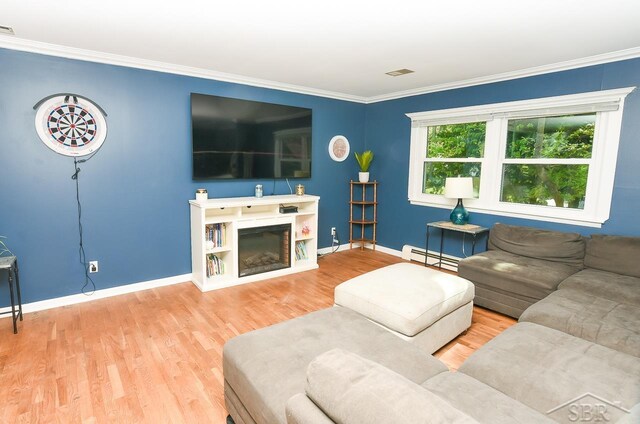 1466 Wilson Ave, Saginaw, MI 48638 - living area featuring a baseboard radiator, wood finished floors, baseboards, crown molding, and a glass covered fireplace