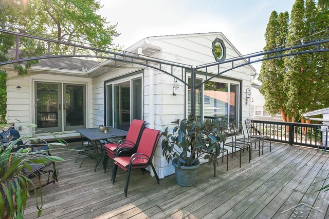 1466 Wilson Ave, Saginaw, MI 48638 - wooden terrace with outdoor dining area