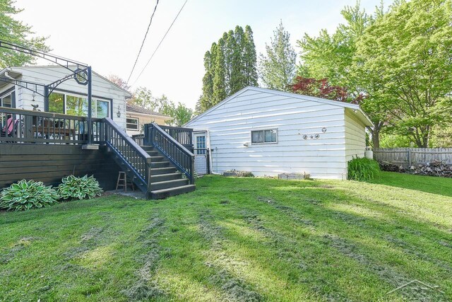 1466 Wilson Ave, Saginaw, MI 48638 - back of house featuring stairway and a wooden deck