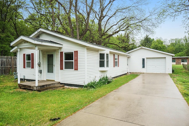 604 W Hill St, Plainwell, MI 49080 - view of front of home with an outdoor structure, a garage, and driveway