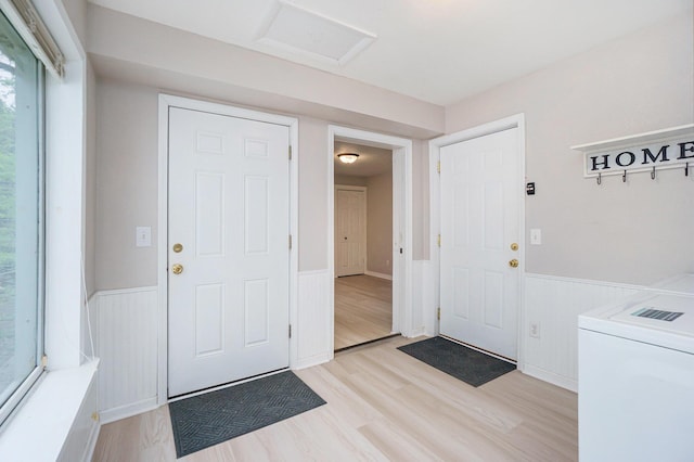 604 W Hill St, Plainwell, MI 49080 - entryway with a wainscoted wall, washer / dryer, and light wood finished floors