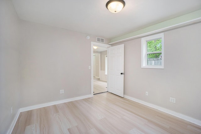 604 W Hill St, Plainwell, MI 49080 - empty room featuring light wood-style flooring and baseboards