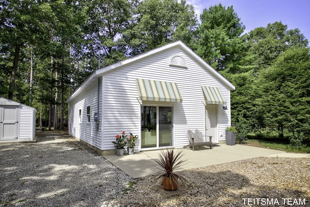 12993 144th Ave, Grand Haven, MI 49417 - rear view of house featuring a patio area