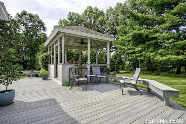 12993 144th Ave, Grand Haven, MI 49417 - wooden terrace with a gazebo, a ceiling fan, view of wooded area, and a lawn