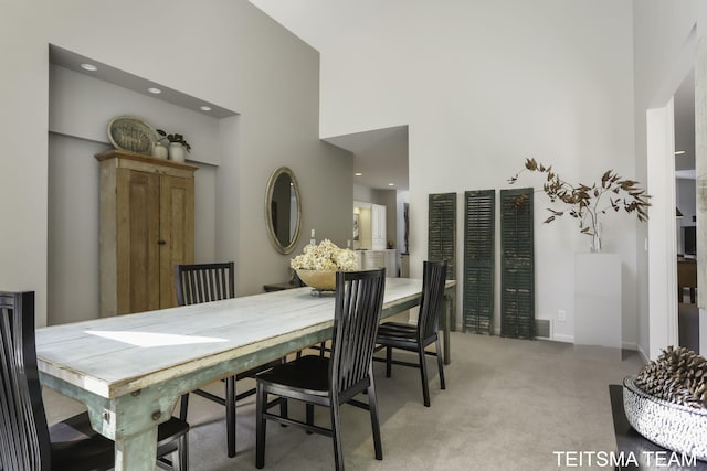 12993 144th Ave, Grand Haven, MI 49417 - dining area with a high ceiling and light colored carpet