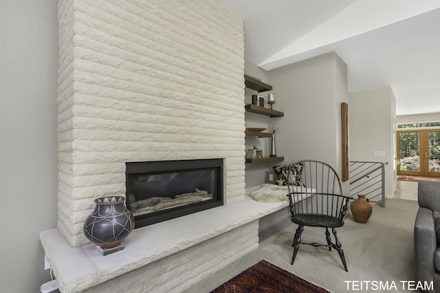 12993 144th Ave, Grand Haven, MI 49417 - living room featuring carpet, a glass covered fireplace, and vaulted ceiling
