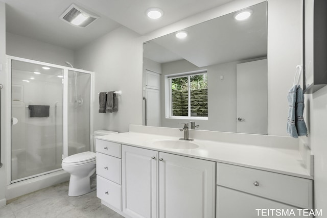 12993 144th Ave, Grand Haven, MI 49417 - full bathroom with toilet, vanity, a shower stall, and recessed lighting