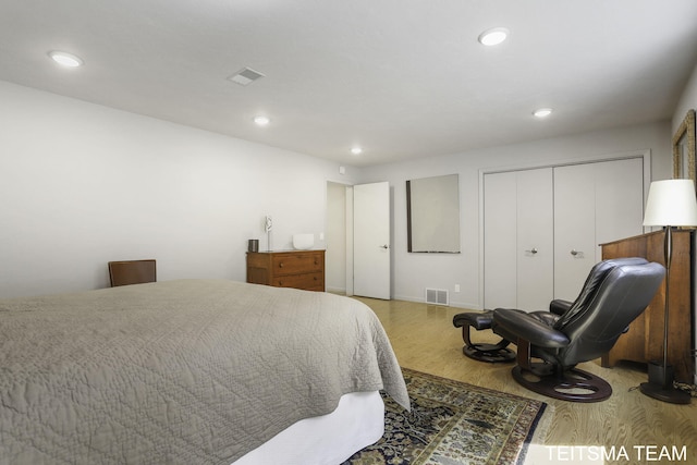 12993 144th Ave, Grand Haven, MI 49417 - bedroom featuring wood finished floors, recessed lighting, and a closet