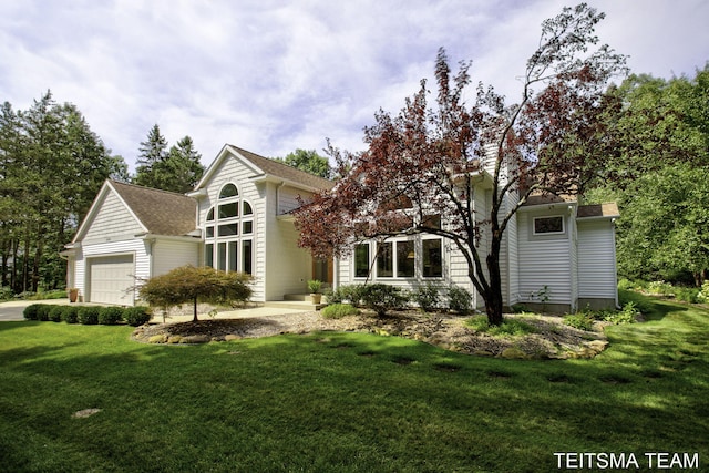 12993 144th Ave, Grand Haven, MI 49417 - view of property hidden behind natural elements featuring a front lawn and roof with shingles
