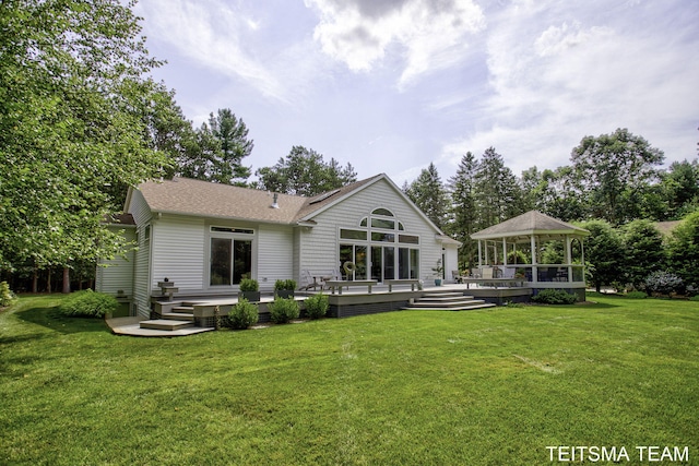 12993 144th Ave, Grand Haven, MI 49417 - rear view of property featuring a gazebo, a lawn, a shingled roof, and a wooden deck