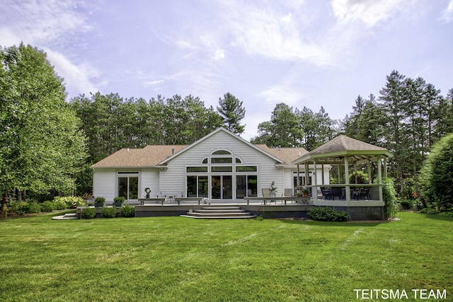 12993 144th Ave, Grand Haven, MI 49417 - rear view of house featuring a deck, a yard, a gazebo, and a shingled roof