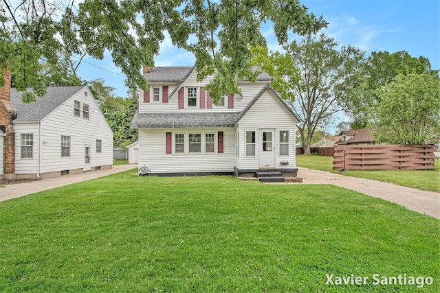 429 Van Allen St SE, Wyoming, MI 49548 - back of property featuring a lawn, an outdoor structure, roof with shingles, and a chimney