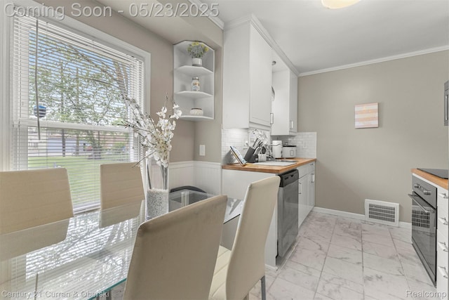 3346 Westpoint St, Dearborn, MI 48124 - kitchen with stainless steel dishwasher, wall oven, light marble finish floors, butcher block countertops, and a sink