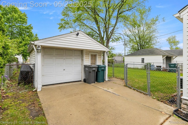 3346 Westpoint St, Dearborn, MI 48124 - detached garage featuring driveway and a gate