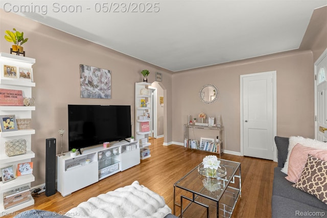 3346 Westpoint St, Dearborn, MI 48124 - living room with wood finished floors, arched walkways, and baseboards