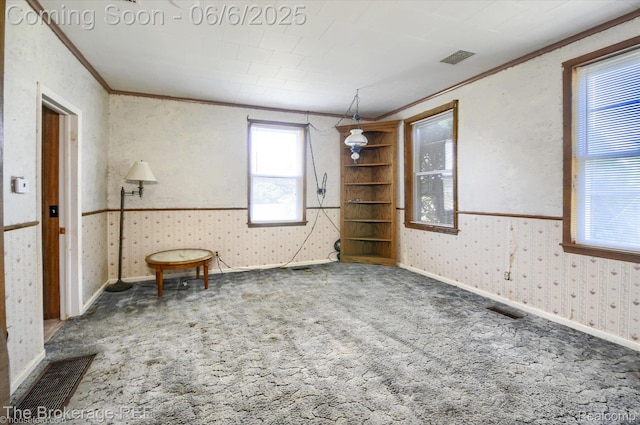 8114 Wilson Rd, Otisville, MI 48463 - carpeted spare room with crown molding and wallpapered walls