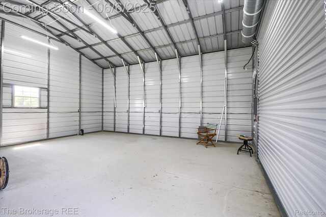 8114 Wilson Rd, Otisville, MI 48463 - garage featuring metal wall