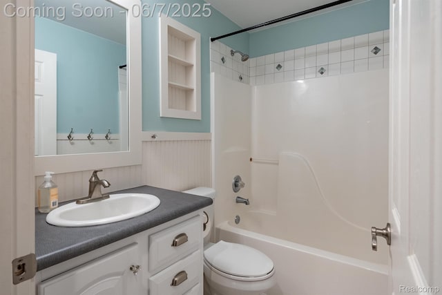 1542 Summerfield Ln, Howell, MI 48843 - full bathroom featuring toilet, vanity, bathing tub / shower combination, and a wainscoted wall