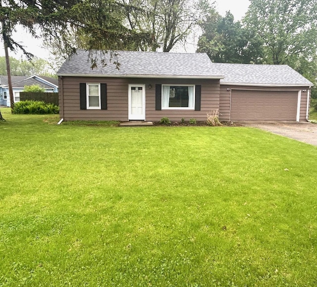526 18th St, Jackson, MI 49203 - view of front of home with driveway, a garage, a front yard, and a shingled roof