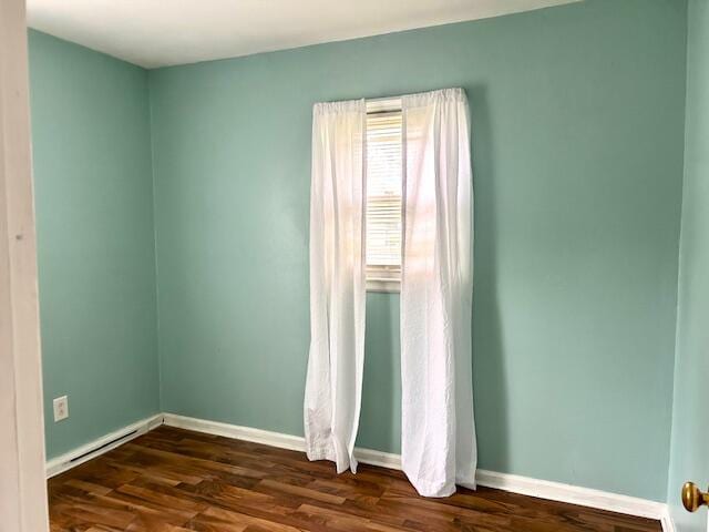 526 18th St, Jackson, MI 49203 - unfurnished room with dark wood-type flooring