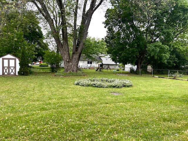 526 18th St, Jackson, MI 49203 - view of yard featuring a storage shed