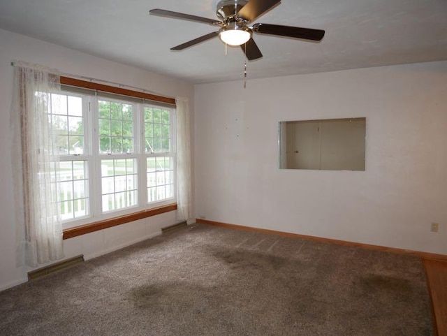 12589 Perry Rd, Battle Creek, MI 49015 - empty room featuring carpet, baseboards, and a ceiling fan