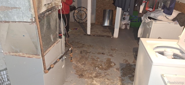 14931 Rossini Dr, Detroit, MI 48205 - bathroom featuring washer / clothes dryer, concrete flooring, and heating unit