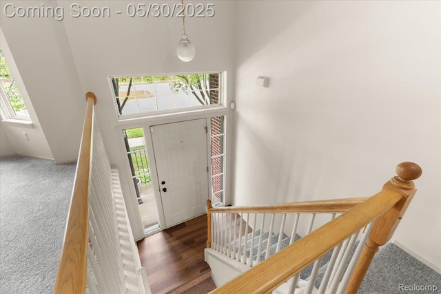 6680 Central City Pkwy, Westland, MI 48185 - carpeted entryway featuring a high ceiling and baseboards
