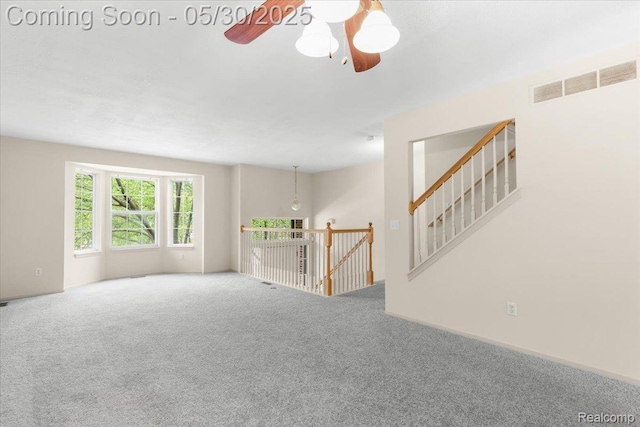 6680 Central City Pkwy, Westland, MI 48185 - unfurnished living room featuring carpet and a ceiling fan