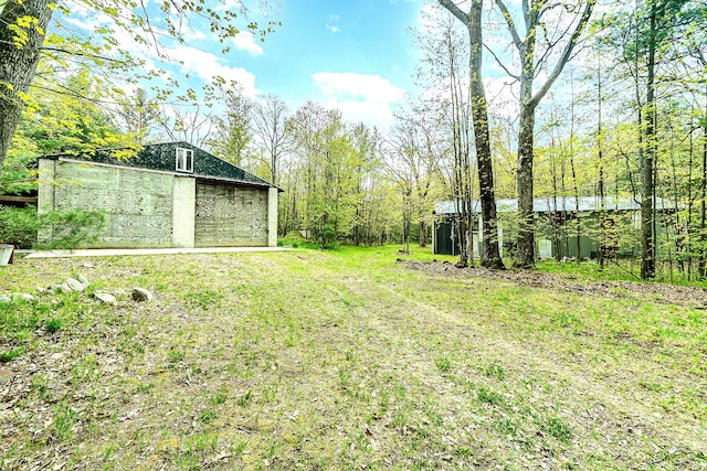 3674 N Harrison Ave, Harrison, MI 48625 - view of grassy yard with an outdoor structure