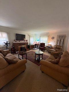 18598 Henry St, Melvindale, MI 48122 - living area with plenty of natural light and a fireplace