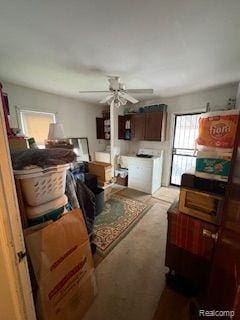 18598 Henry St, Melvindale, MI 48122 - living room featuring a ceiling fan, light carpet, and washer / dryer