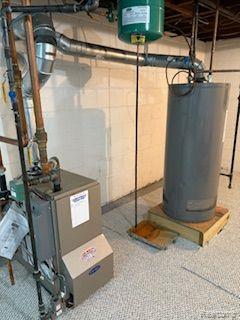 18598 Henry St, Melvindale, MI 48122 - utility room with water heater and a heating unit