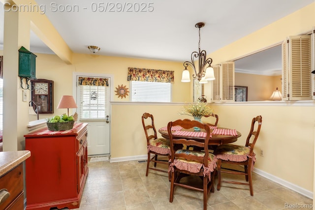 22540 Devonshire St, Woodhaven, MI 48183 - dining room featuring a chandelier and baseboards