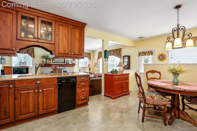 22540 Devonshire St, Woodhaven, MI 48183 - kitchen featuring black dishwasher, a sink, light countertops, glass insert cabinets, and brown cabinetry
