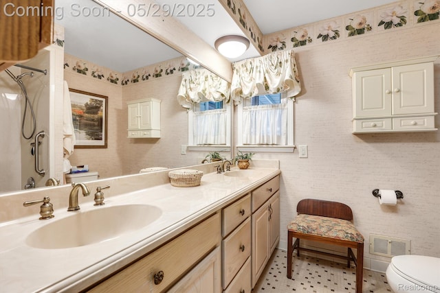 22540 Devonshire St, Woodhaven, MI 48183 - full bathroom featuring toilet, double vanity, and baseboards