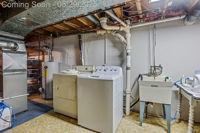 22540 Devonshire St, Woodhaven, MI 48183 - washroom featuring gas water heater, washer and clothes dryer, and heating unit