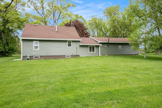 5778 Borland St, Sears, MI 49679 - back of house with a yard and a shingled roof