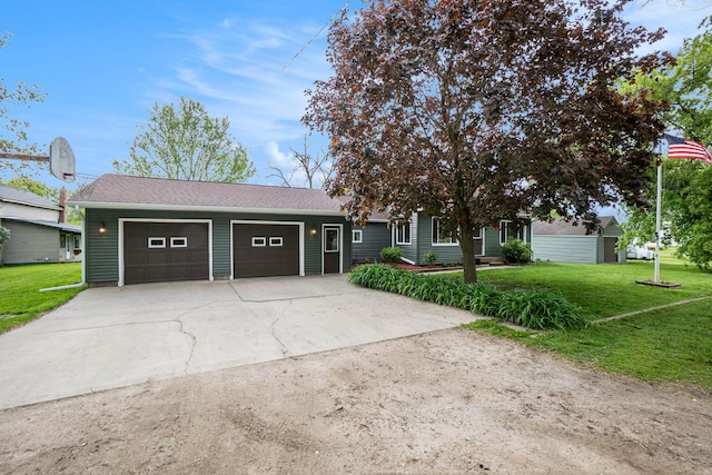 5778 Borland St, Sears, MI 49679 - ranch-style home featuring an attached garage, concrete driveway, a front lawn, and roof with shingles