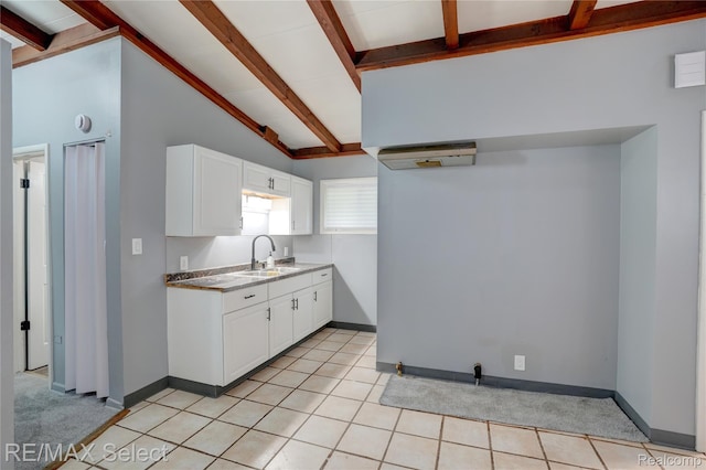 1925 Gilmartin St, Flint, MI 48503 - kitchen with a sink, white cabinets, and baseboards