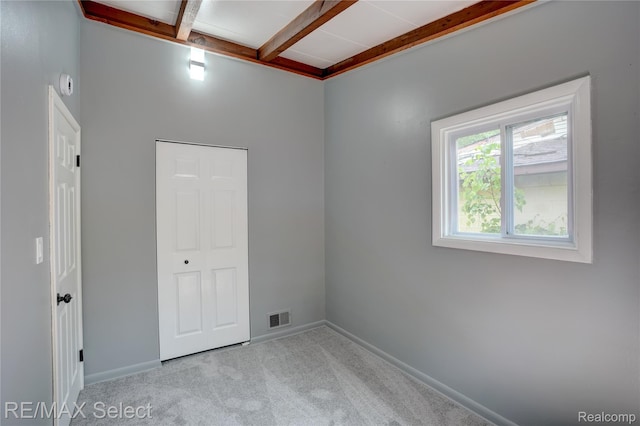 1925 Gilmartin St, Flint, MI 48503 - carpeted spare room featuring beam ceiling, baseboards, and coffered ceiling